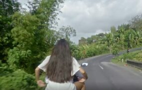 美女公路坐摩托车行驶背影视频素材